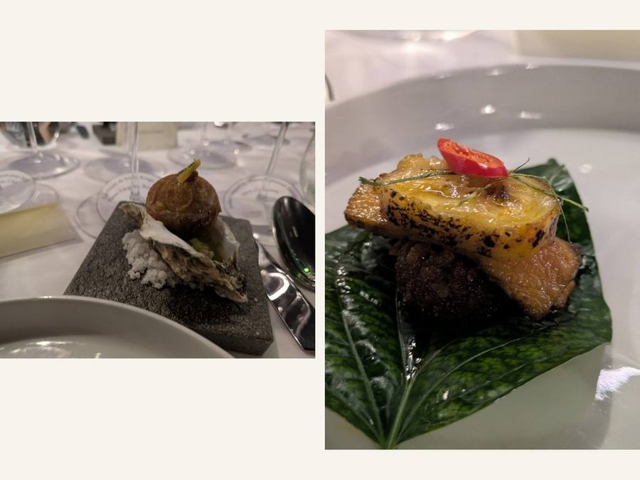 Miang Kham: a bite on a stone slab beside a leaf-wrapped bite topped with chili.