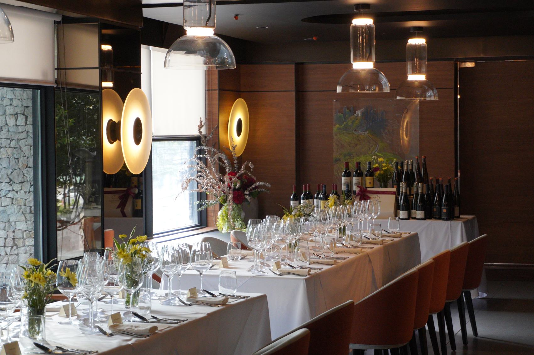 The table set for Common Ground at Dominion Cellar, glasses running its length.